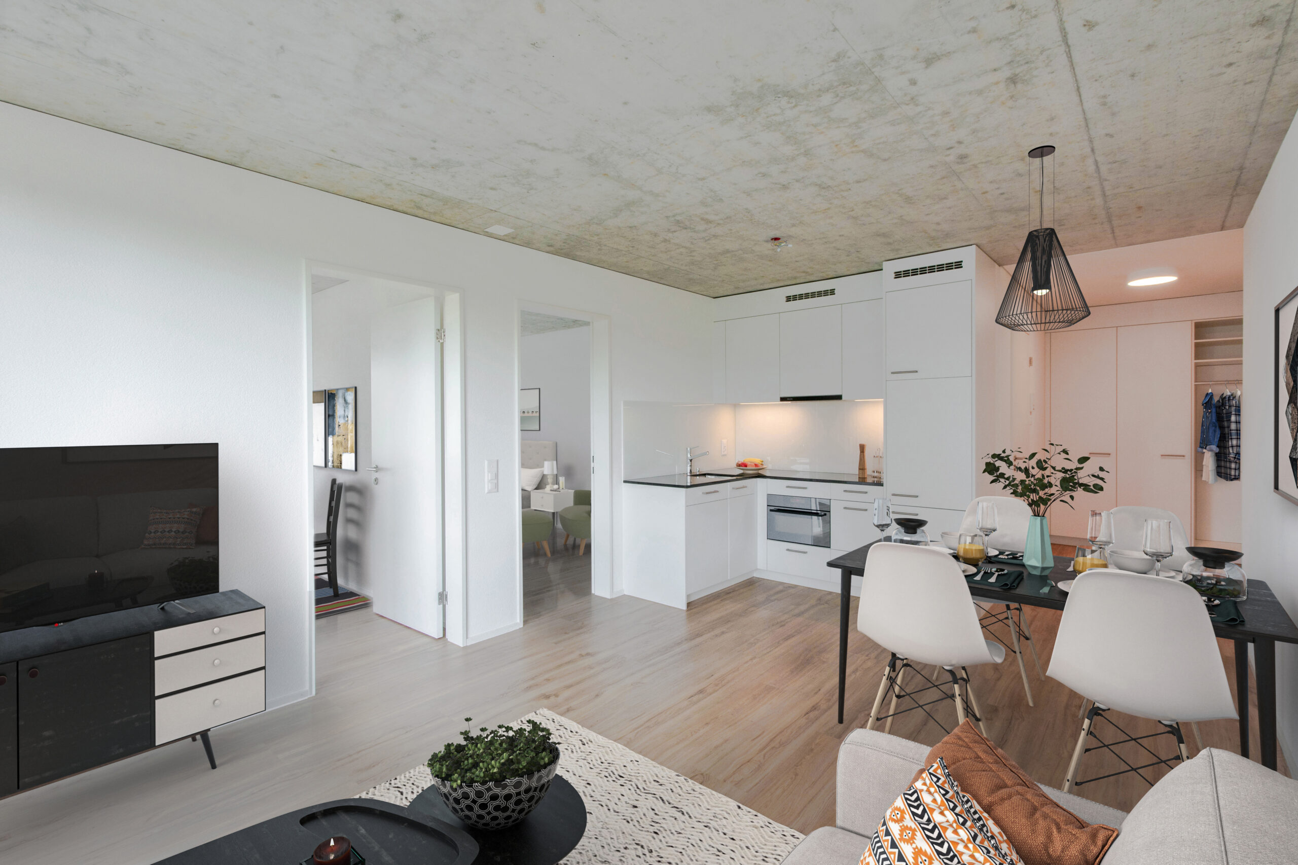 Ein moderner, gemütlicher Wohnbereich in einem Apartment mit kleiner Küche, Esstisch für vier Personen und Sofa. Der Raum verfügt über helle Holzböden, einen Fernseher, dekorative Pflanzen und ein minimalistisches Design in neutralen Tönen.